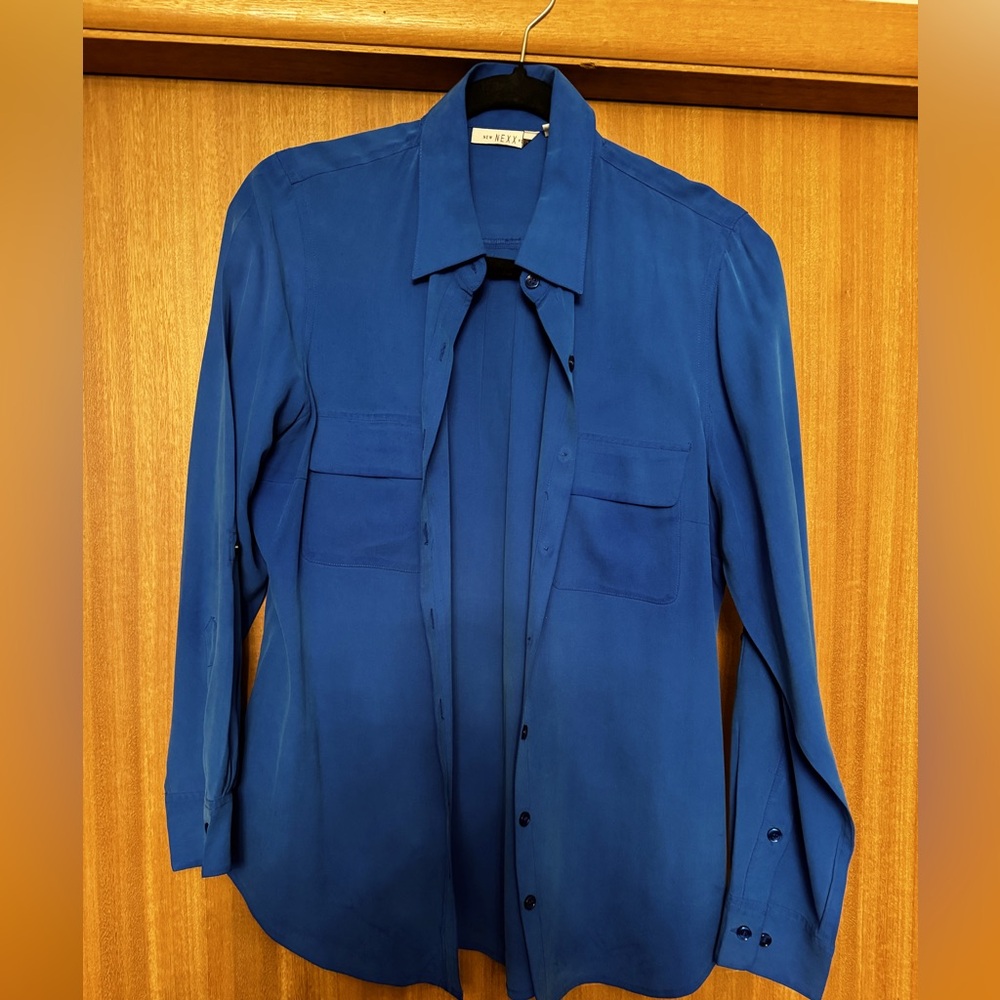 Silk blouse, beautiful! Ultra rich feel. 100% satin but not shiny.